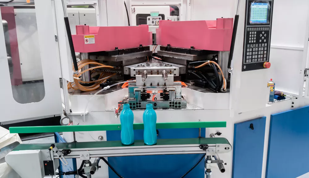 IBM machine pharmaceutical bottle production case showing PP bottle output from injection blow molding