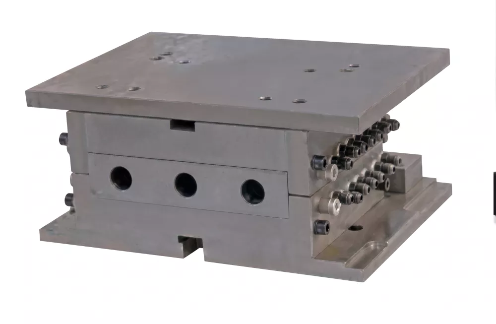 IBM injection mold showing core rod and cavity layout for pharmaceutical bottle production